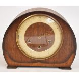 An Art Deco oak cased Westminster chiming eight day mantel clock,