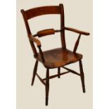 An elm seated Oxford bar back elbow chair in turned supports.