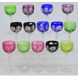 A matched set of fourteen Bohemian cut glass hock glasses, each with coloured bowls. CONDITION