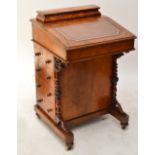 A Victorian walnut and inlaid Davenport desk with hinged super structure and four side drawers,