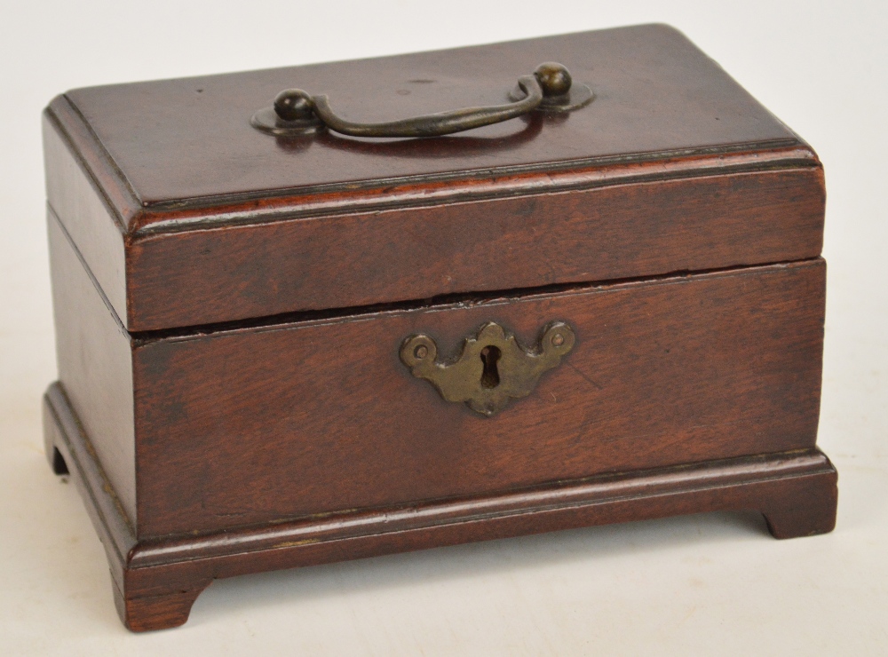 A small Georgian mahogany tea caddy of rectangular form raised on four bracket feet,