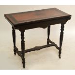 A late 19th century aesthetic ebonised rectangular foldover card table on ring turned stretchered