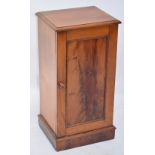 A late Victorian mahogany single door bedside cupboard with plinth base.