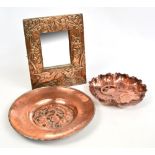 A Hugh Wallis copper hammered circular charger embossed to the central reserve with stylised