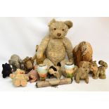 Seven early 20th century straw filled teddies/animals, including a Merrythought horse,