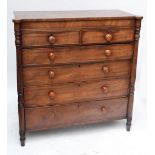 An early Victorian mahogany chest of two chest of two short and four long graduated drawers raised