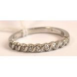 A platinum diamond set half eternity ring, size M.