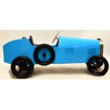 A child's battery operated car presented as a Bugatti with pale blue body and silvered trim,