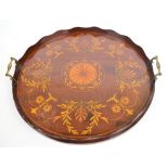 A Edwardian mahogany and satinwood inlaid circular twin handled tea tray, diameter 46.5cm.