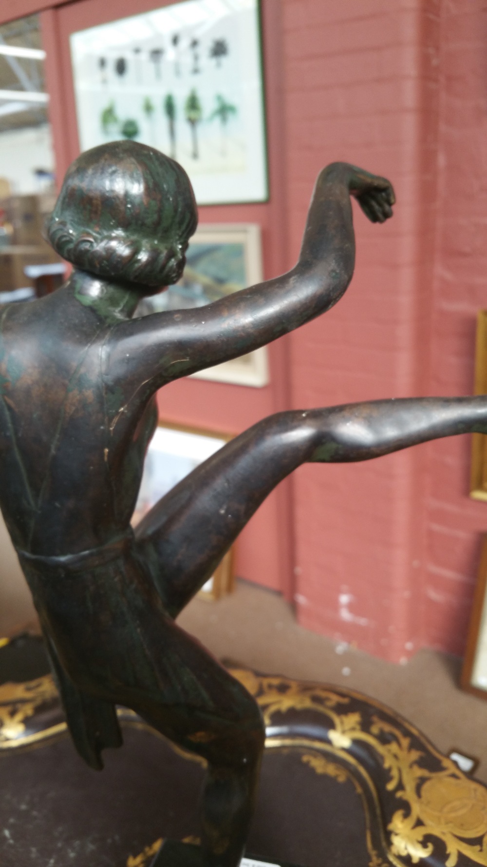 An Art Deco style spelter figure of a gymnast dancing with hoops balancing on one leg, - Image 4 of 4