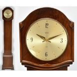 A 1940's walnut grandmother clock with circular dial inscribed "Smiths" and with replaced battery