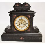 A late 19th century French black slate mantel clock with white enamel chapter ring set with Roman