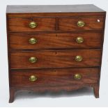 A George IV mahogany chest of three long graduated drawers raised on splay bracket feet.