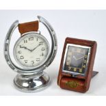 A 1930's/40's leather cased chrome plated Jaeger LeCoultre travel clock with black dial and