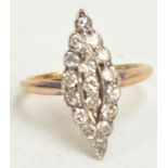 An Art Deco diamond ring, the seventeen stones set in a marquise shape, on pierced gallery, size
