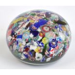 A mid 19th century Clichy "Scrambled" millefiori glass paperweight, diameter 6.5cm, height 4.5cm.