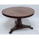 An early Victorian rosewood breakfast table with circular top above tapering central column to