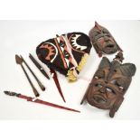 A small quantity of Kenyan tribal artifacts comprising two carved masks featured elephant heads and