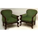 A large pair of French Breton mahogany framed armchairs with padded backs and arms,