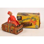 A Gescha clockwork "Express Boy" toy, boxed, with key. CONDITION REPORT: Overall in good order, just