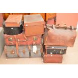 A mixed lot of suitcases to include two Gladstone type examples, a leather rectangular example,