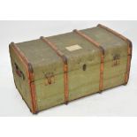 A large vintage wooden bound travelling trunk.