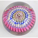 A 1950s Whitefriars glass millefiori paperweight set with five concentric bands of multicoloured