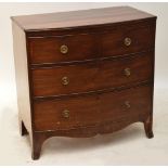 An early 19th century mahogany chest of two short above two long drawers, bowfronted,