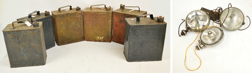 Six vintage petrol cans including four Shell, one ESSO and one Pratts,