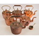 A collection of six copper kettles.