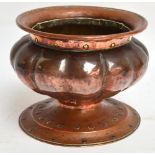 RICHARD LLEWELLYN BENSON RATHBONE (1864-1939); a small Arts and Crafts lobed copper jardinière