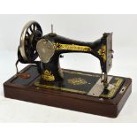 A cased Singer sewing machine.