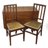 A set of six Edwardian mahogany dining chairs with padded seats and square section legs,