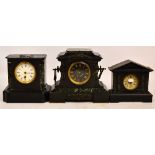 A late 19th century French black slate mantel clock with white enamel dial set with Roman