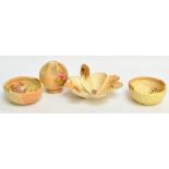 A small collection of Royal Worcester blush ivory items comprising a gilt handled leaf shaped dish