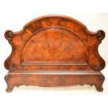 A Victorian mahogany bed foot board with shaped top and fielded demi-lune centre panel,