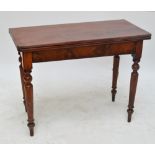 A 19th century mahogany fold over tea table on turned tapering legs, width 98cm.