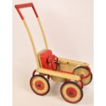 A 1950s Mobo Magic child's dolls stroller with left/right mechanism to the bar and voice box to the