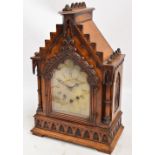 A Victorian Gothic oak bracket clock, the arched case with engraved dial inscribed "Edwards,