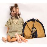 An Armand Marseille bisque headed doll with open mouth revealing four teeth,