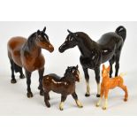 A Beswick Dartmoor pony, 1642 "Warlord", two Beswick foals; a palomino and a glossy Shetland, and