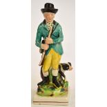 An early 19th century Neale & Co painted figure of a huntsman with his dog, on square base, c.