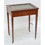 An Edwardian mahogany crossbanded and inlaid rectangular bijouterie cabinet on square tapering legs