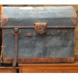A large vintage leather and canvas domed travelling trunk.