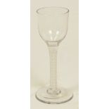 A Georgian wine glass with double opaque airtwist stem and plain bowl, height 14cm. CONDITION