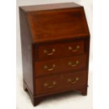 A small Edwardian mahogany and inlaid bureau.