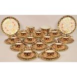 A Royal Crown Derby 2451 pattern Imari decorated tea set comprising two bread and butter plates,