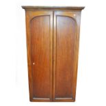 A late Victorian mahogany two door wardrobe with moulded cornice.