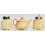 A Locke & Co. blush ivory teapot with gilt heightened foliate decoration, shape 271, with black