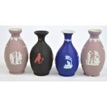 Four Wedgwood jasperware baluster vases, two puce ground,